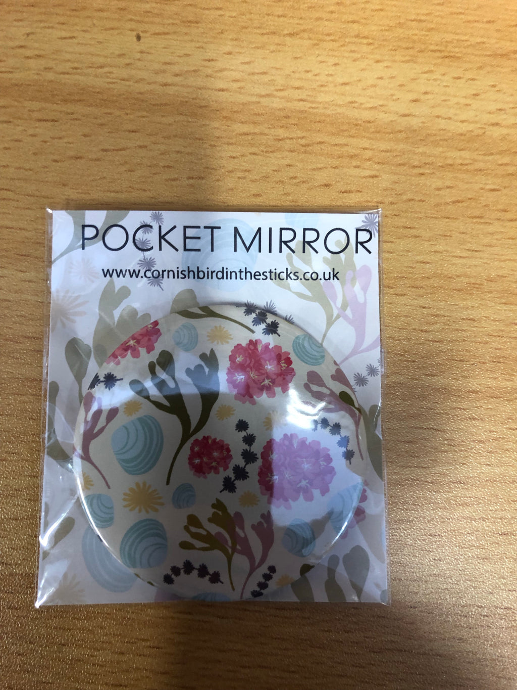 Pocket mirror and key rings designed in Cornwall